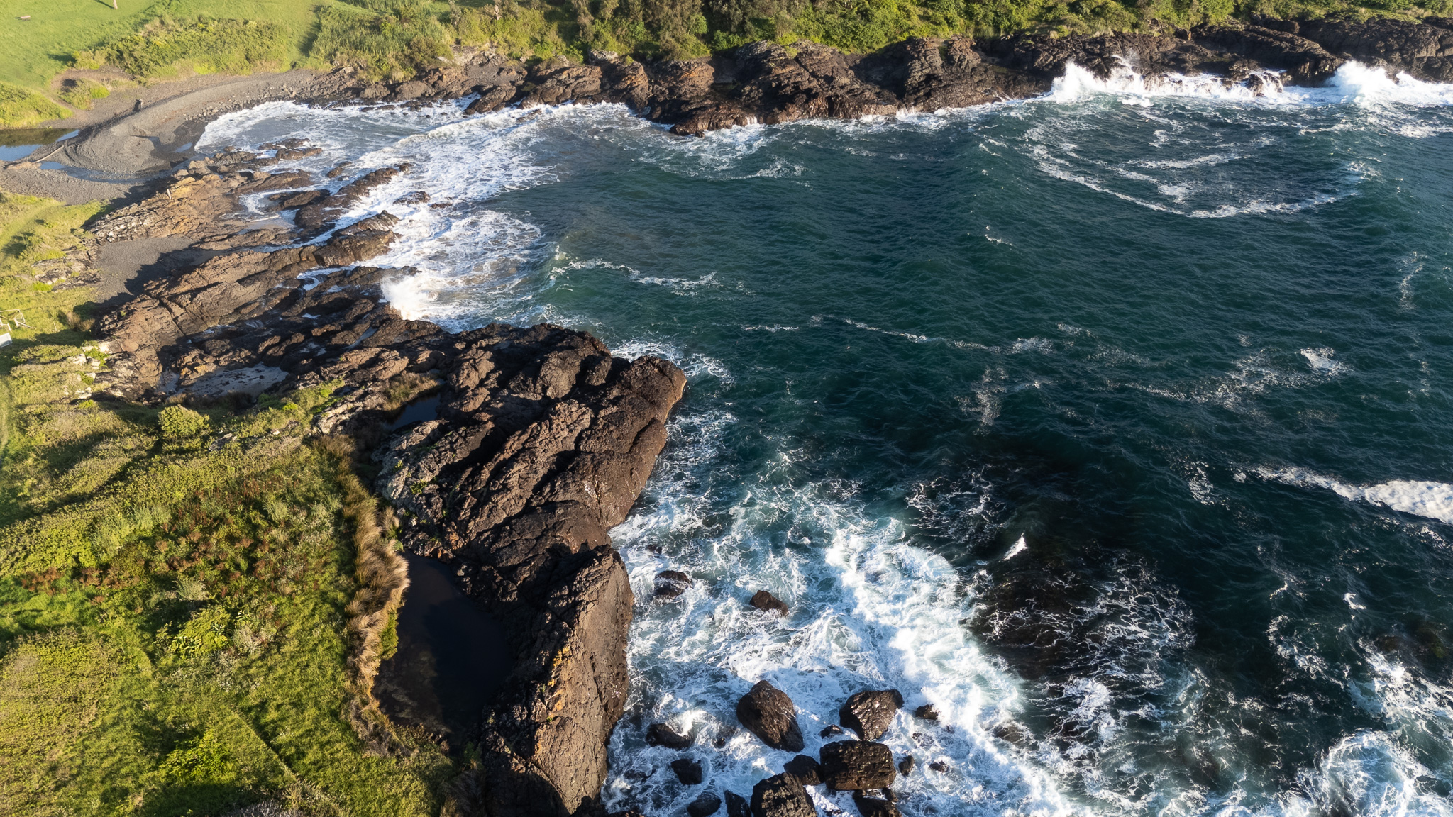 A small rock beach, north of Bombo — no name on any map